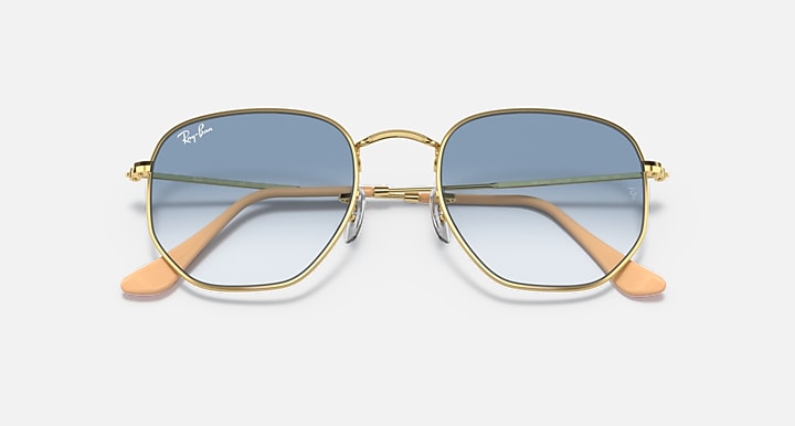 Hexagonal sunglasses front view, gold frame with blue gradient lenses and orange temples.