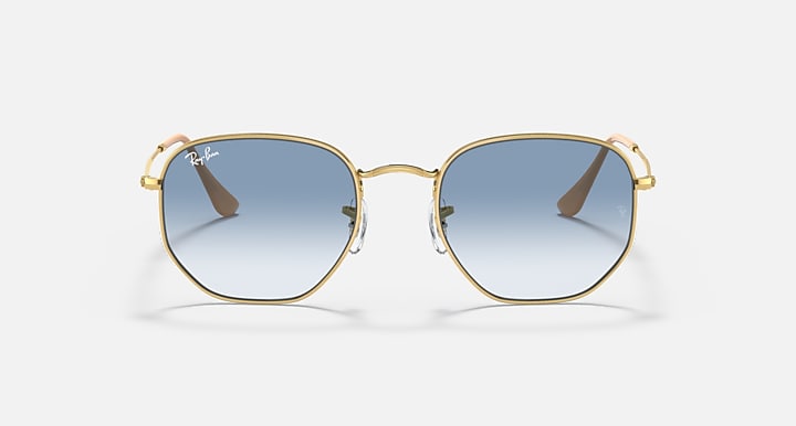 Hexagonal sunglasses with gold frame and blue gradient lenses, front view.