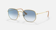 Hexagonal sunglasses, gold frame with blue gradient lenses and tan temples.