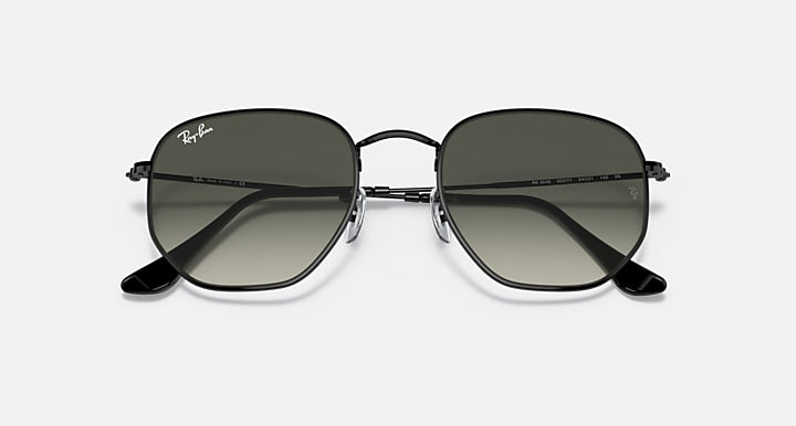 Ray-Ban hexagonal sunglasses with dark green gradient lenses and black frame edges
