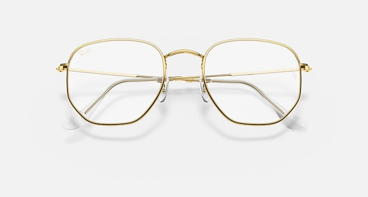 Ray-Ban hexagonal sunglasses with gold metal frame and clear lenses