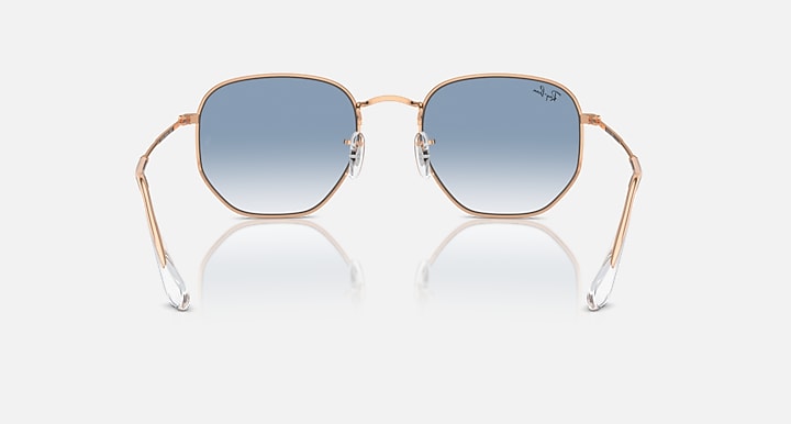 Ray-Ban hexagonal sunglasses with rose-gold frame and blue gradient lenses
