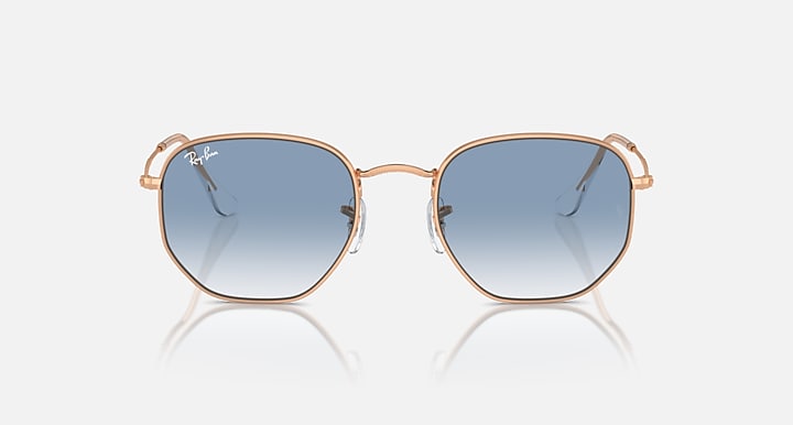 Ray-Ban hexagonal sunglasses with rose-gold frame and light blue tinted lenses