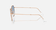 Ray-Ban hexagonal sunglasses side view with rose-gold frame and blue lenses