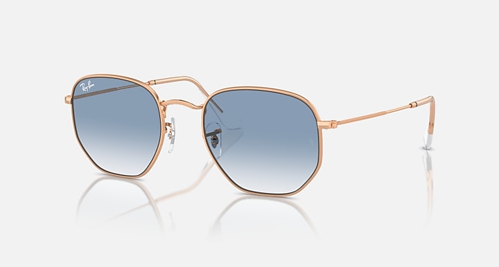 Ray-Ban hexagonal sunglasses with rose-gold frame and blue gradient lenses