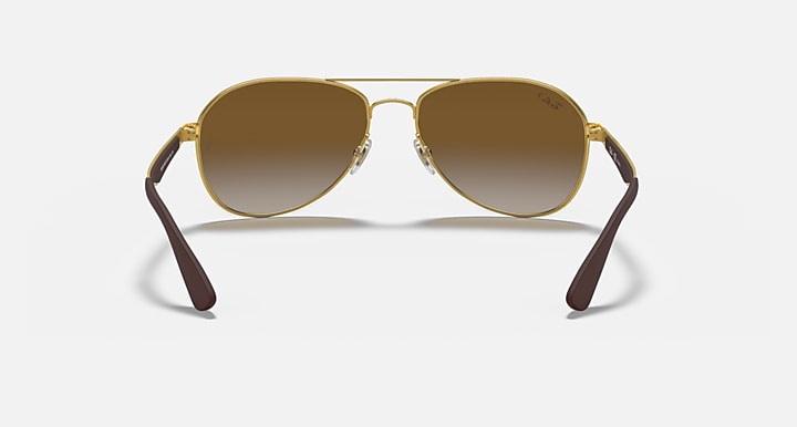 Ray-Ban aviator sunglasses with gold frame and brown tinted lenses