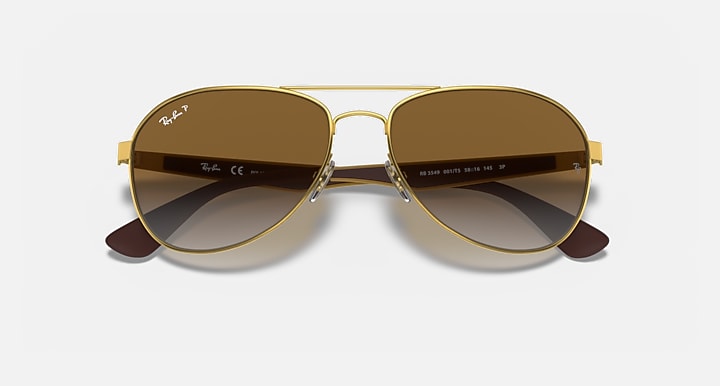 Ray-Ban aviator sunglasses with gold frame and brown gradient tinted lenses