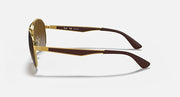 Ray-Ban aviator sunglasses side view with gold frame and brown temple arms