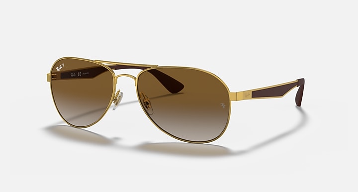 Ray-Ban aviator sunglasses with gold frame and brown gradient lenses