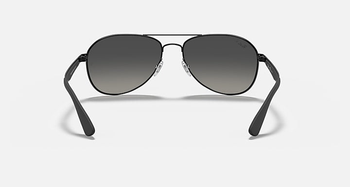 Aviator sunglasses with dark gray tinted lenses and black frame, front view
