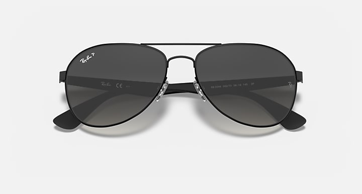 Ray-Ban aviator sunglasses with black frame and dark gray gradient tinted lenses