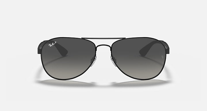 Ray-Ban aviator sunglasses with black frame and dark gray tinted lenses