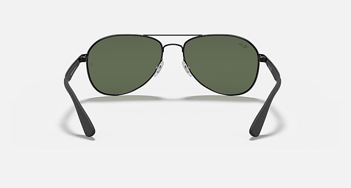 Ray-Ban aviator sunglasses with matte black frame and dark green mirrored lenses