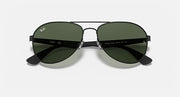 Aviator sunglasses with dark green tinted lenses and matte black frame