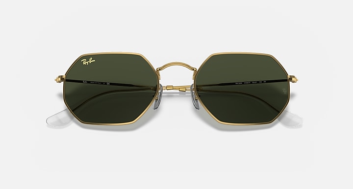 Octagonal sunglasses with gold frame, dark green lenses and logo details