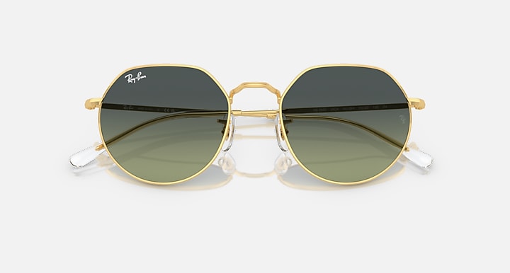 Ray-Ban round sunglasses with gold frame and dark tinted lenses