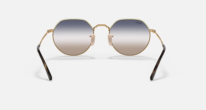 Round metal sunglasses with gold frame and silver-to-gray gradient lenses