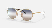 Round metal sunglasses with gold frame and clear-to-gray gradient lenses