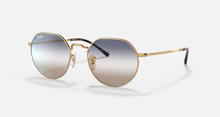 Round metal sunglasses with gold frame and clear-to-gray gradient lenses