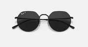 Round sunglasses with black frame and dark lenses, slight angled view