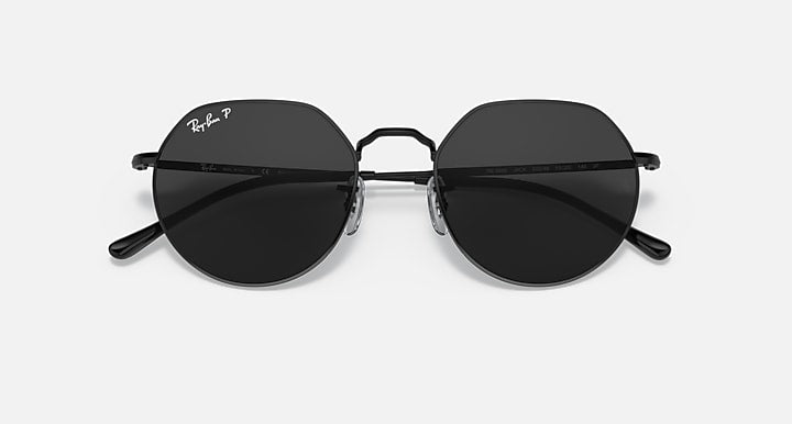 Round sunglasses with black frame and dark lenses, slight angled view