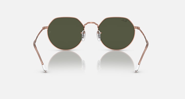 Round sunglasses with rose gold frame and dark olive tinted lenses, front view