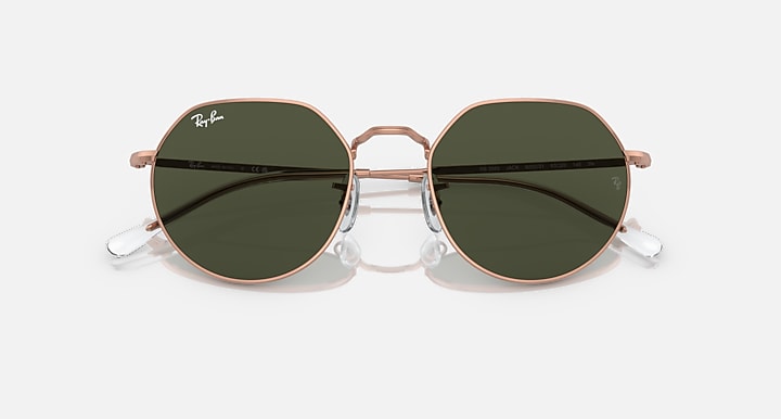 Round sunglasses with rose gold frame and dark green tinted lenses, front view