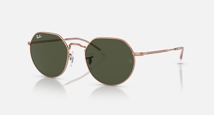 Round sunglasses with rose gold frame and dark green tinted lenses