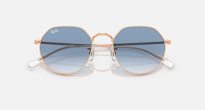 Ray-Ban round sunglasses with rose gold frame and dark blue tinted lenses
