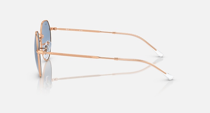 Ray-Ban round sunglasses, side view, rose gold frame with light blue lenses