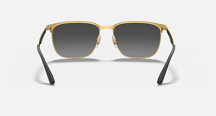 Rectangular sunglasses with gold-tone frame, dark lenses, black arms