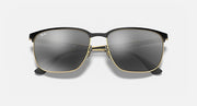 Square sunglasses with dark grey lenses, dark frame and gold-tone bridge