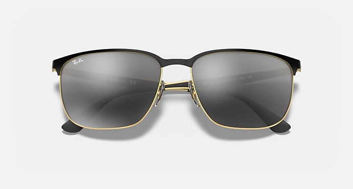 Square sunglasses with dark grey lenses, dark frame and gold-tone bridge