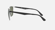 Sunglasses in black with dark green lenses, side profile and curved temple tips