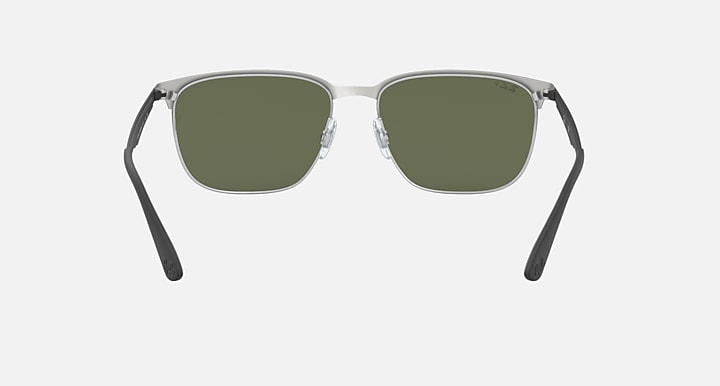 Sunglasses with green-tinted lenses and silver metal frame; straight front view