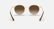 RB3578 sunglasses with gold frame and dark brown tinted round lenses.