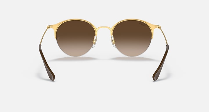 RB3578 sunglasses with gold frame and dark brown tinted round lenses.