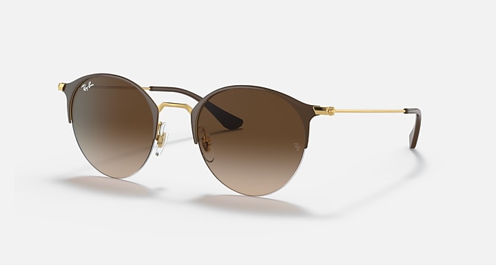 RB3578 sunglasses with black frames, gold rims, and brown gradient lenses.