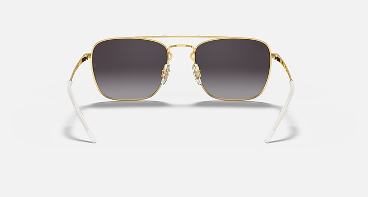 Square sunglasses with gold frame and dark lenses