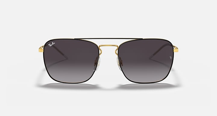 Square sunglasses with black frame and dark gradient lenses with gold accents