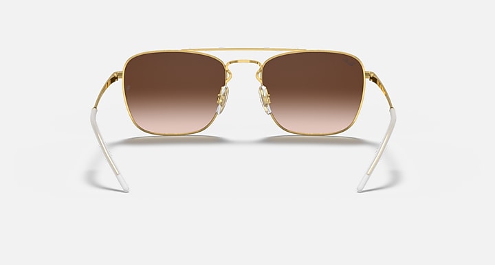 Square sunglasses with gold frame and warm brown gradient lenses