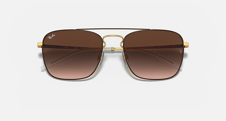 Square sunglasses with dark lenses and black frame with gold details