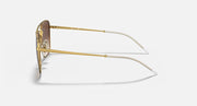 Side view of gold sunglasses with thin clear temple arms