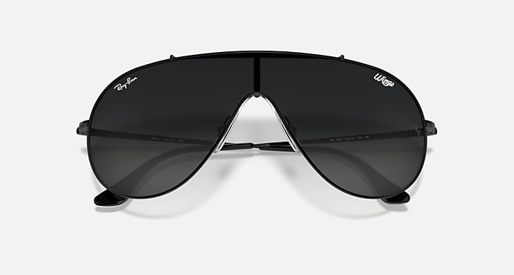 Aviator-style sunglasses with black frames and dark smoke lenses, center bridge view