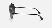 Aviator-style sunglasses with black frames and dark smoke lenses, side view