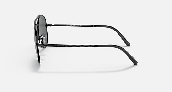 Aviator sunglasses with black metal frame and dark lenses, side profile.