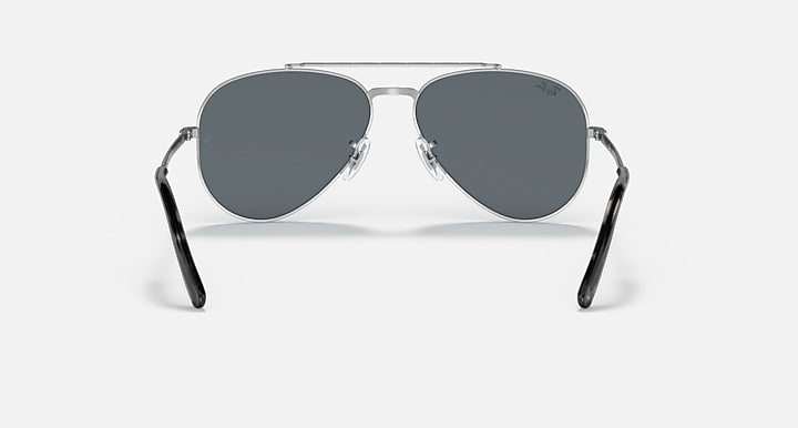 Aviator sunglasses with black-and-silver metal frame and dark gray lenses, front view.