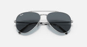 Aviator sunglasses with silver-tone metal frame and dark lenses, close front view.