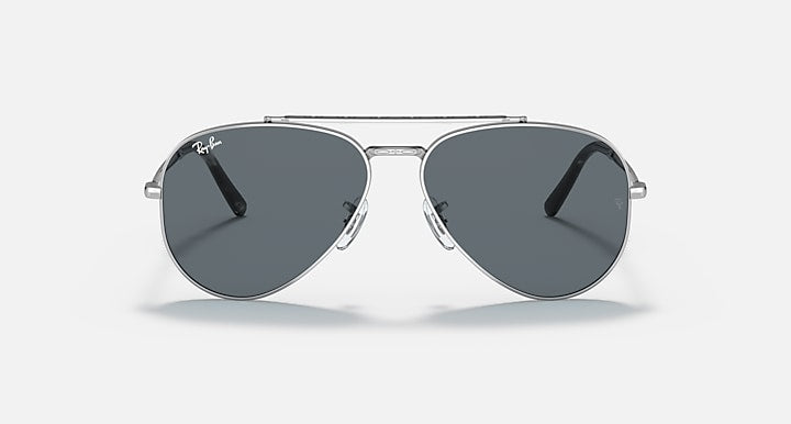 Aviator sunglasses with silver-tone metal frame and dark gray lenses, front angled view.