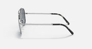 Aviator sunglasses with silver-tone metal frame and dark lenses, side profile.